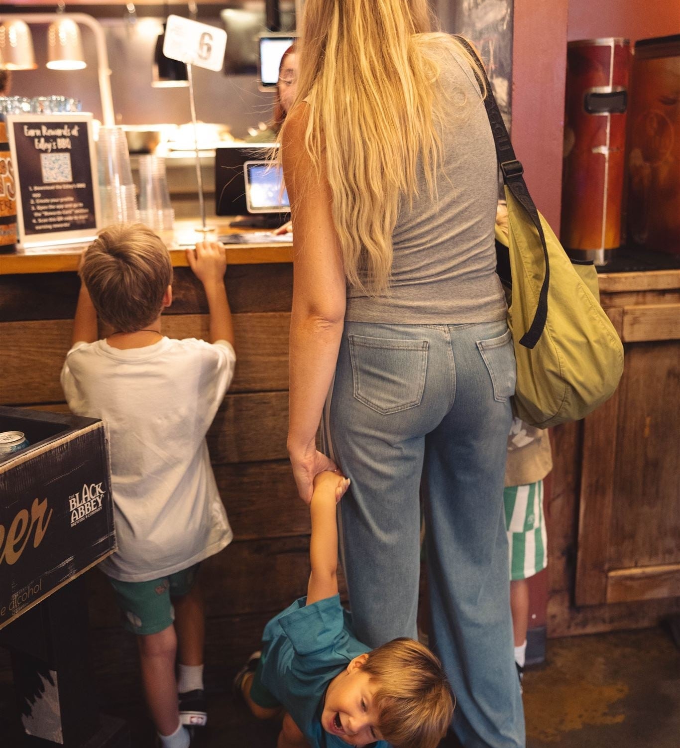 Toddler starting to have a meltdown while mom is in line