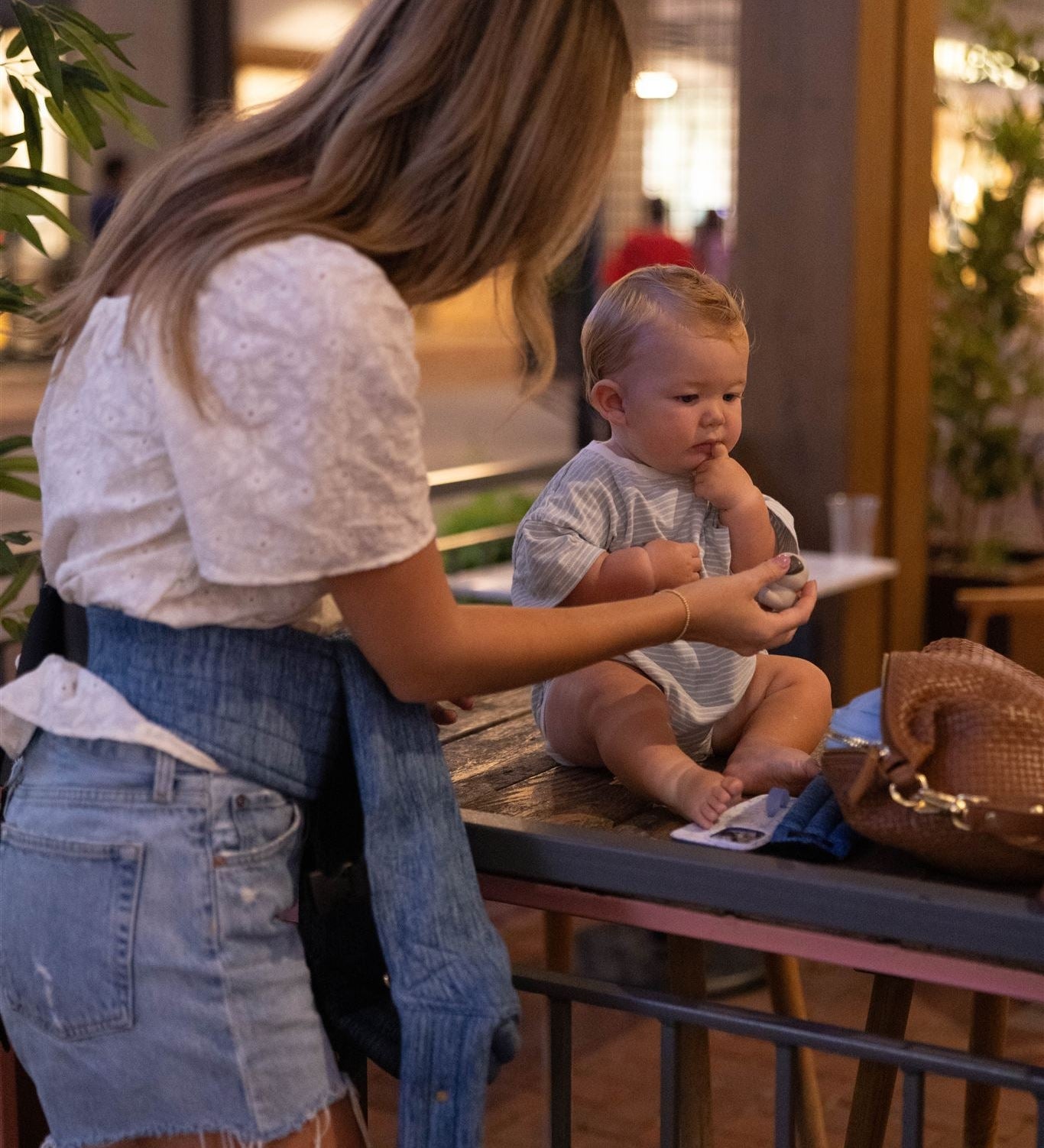 Mom leaving house with baby