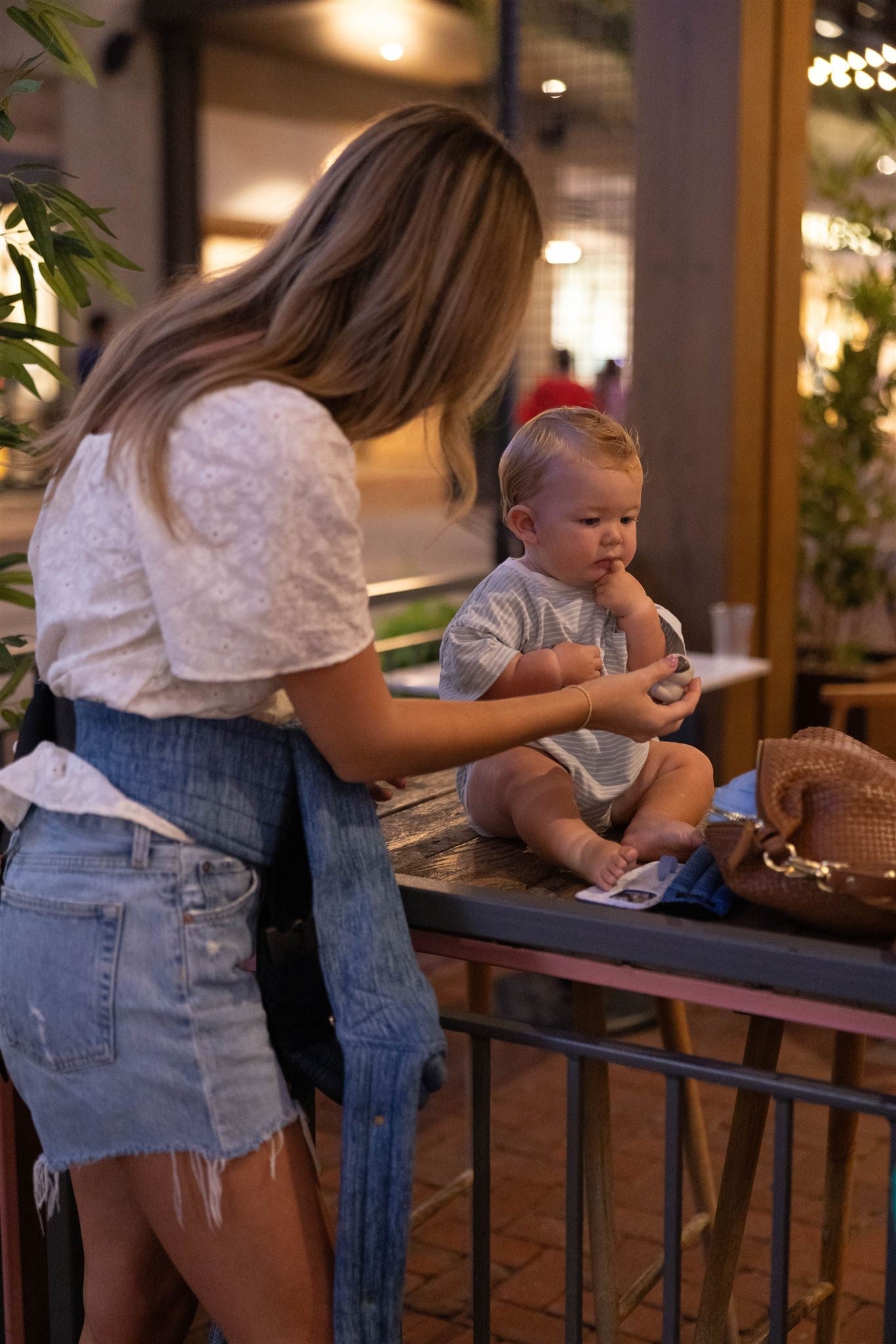 Mom leaving house with baby